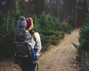 Mother and child hiking in the forest