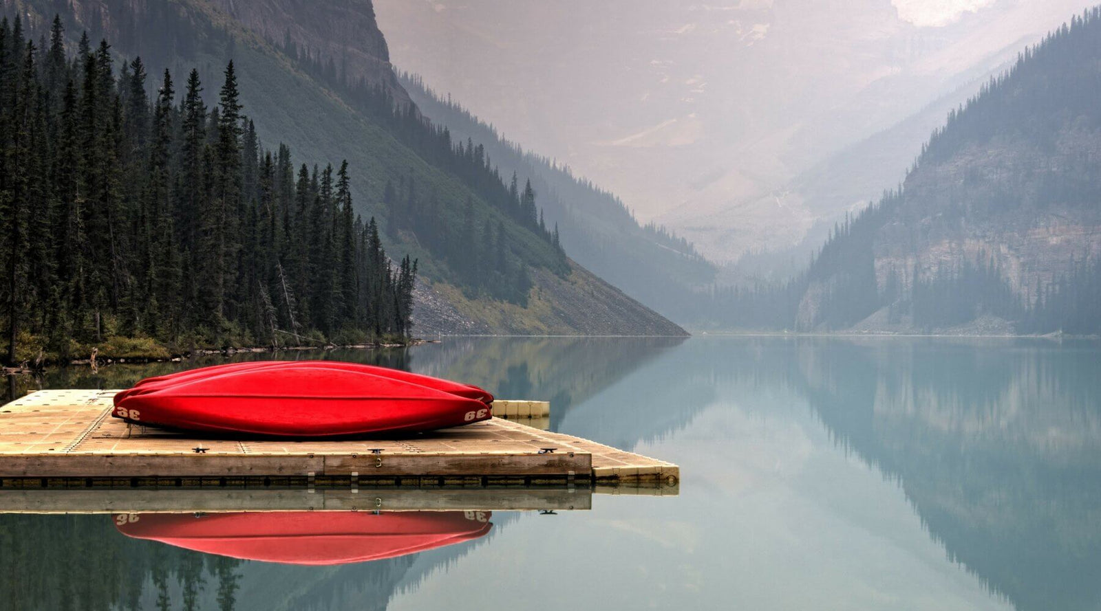 Canoes on dock at lake